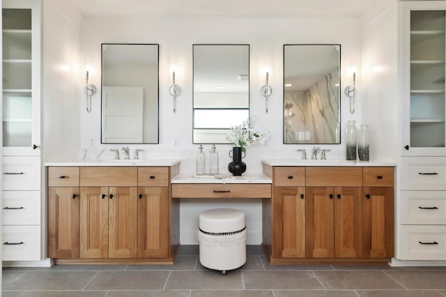 bathroom featuring tile patterned flooring and vanity