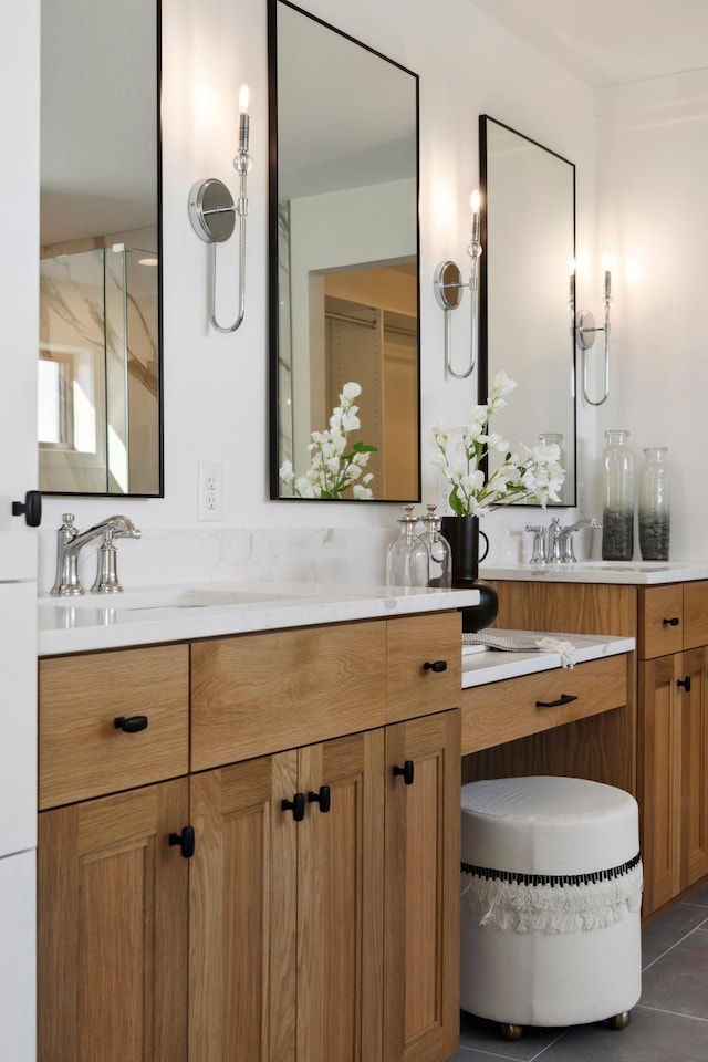 bathroom featuring tile patterned flooring and vanity