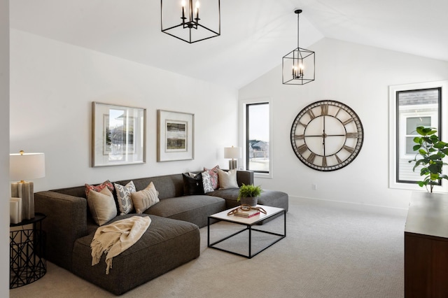 carpeted living room with a wealth of natural light, vaulted ceiling, and a notable chandelier