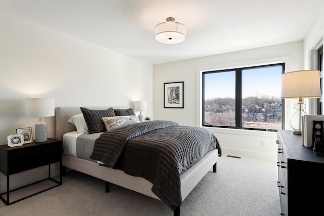 bedroom with light carpet