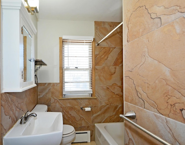 full bathroom featuring sink, tiled shower / bath combo, toilet, tile walls, and a baseboard radiator