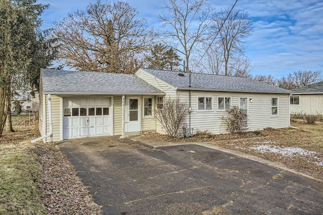 ranch-style house featuring a garage