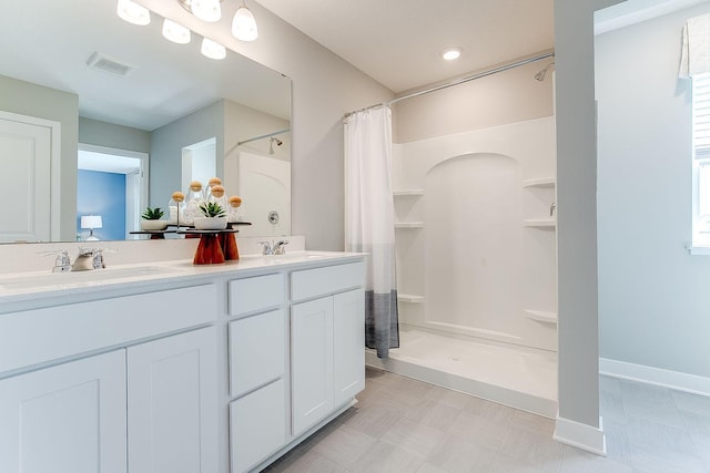 bathroom with vanity and a shower with shower curtain