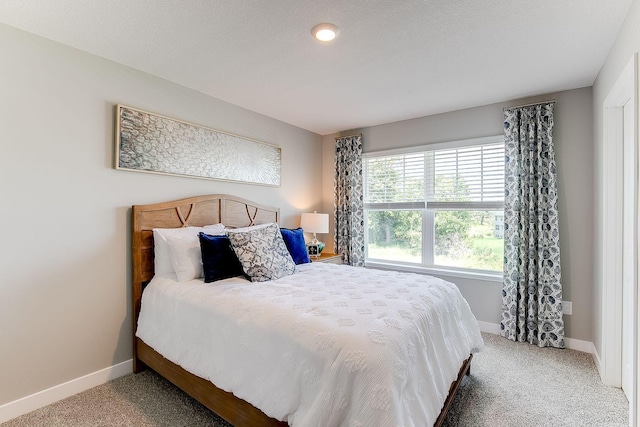 carpeted bedroom with a textured ceiling