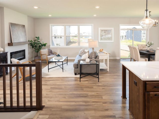 living room with light hardwood / wood-style flooring and a wealth of natural light