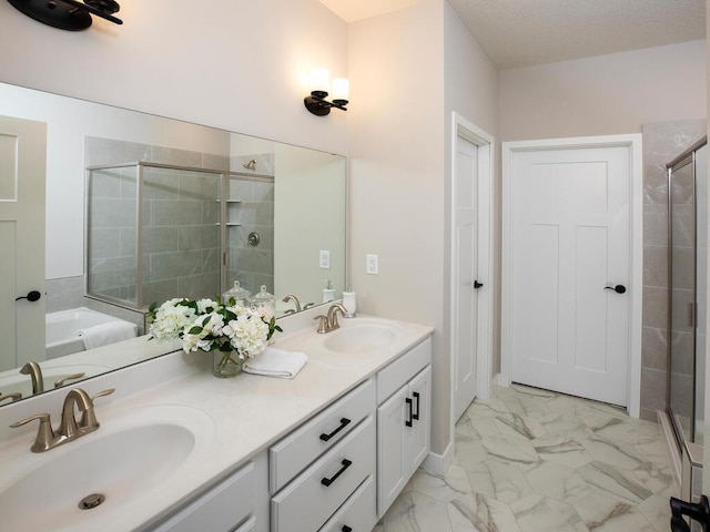 bathroom with plus walk in shower and vanity