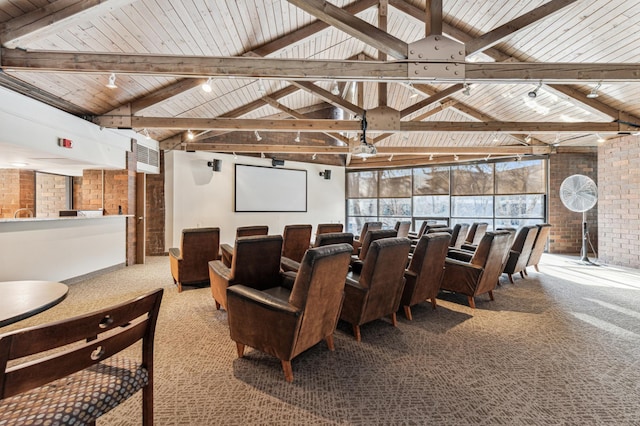 carpeted cinema with beam ceiling, wooden ceiling, and brick wall