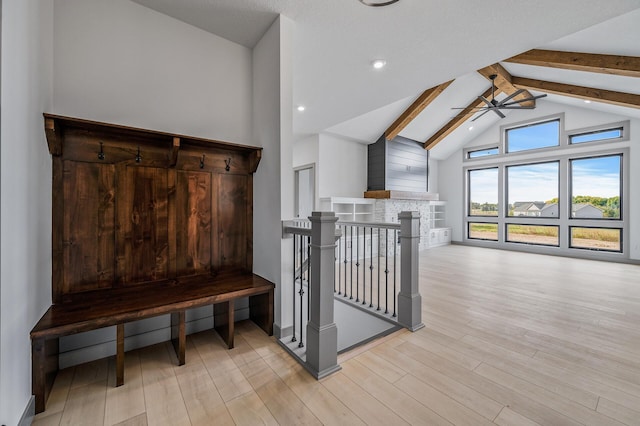 mudroom with high vaulted ceiling, light wood finished floors, beamed ceiling, and a ceiling fan