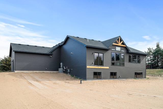 exterior space with a shingled roof