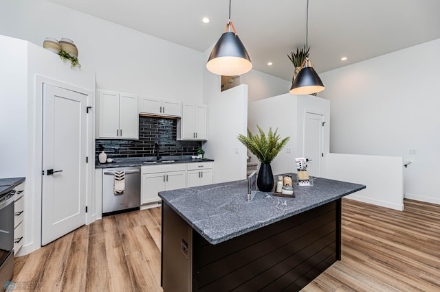 129 Pine Ave, Mapleton, ND 58059 - kitchen with stainless steel dishwasher, light wood-style flooring, white cabinets, a sink, and recessed lighting