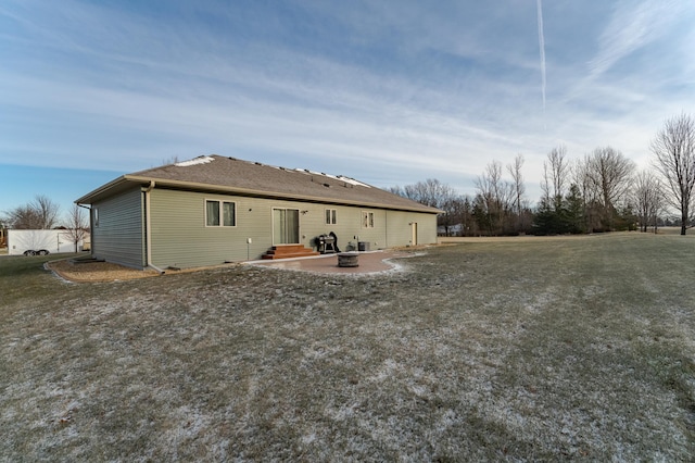 rear view of house with a patio area and a lawn