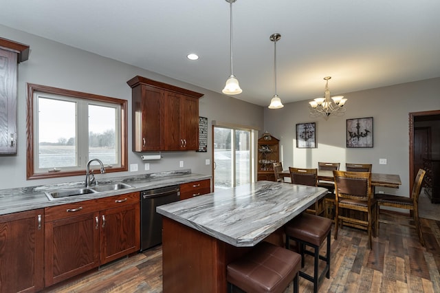 2155 Maple Leaf Ln NE, Owatonna, MN 55060 - kitchen featuring dishwasher, dark wood finished floors, a chandelier, a center island, and a kitchen bar