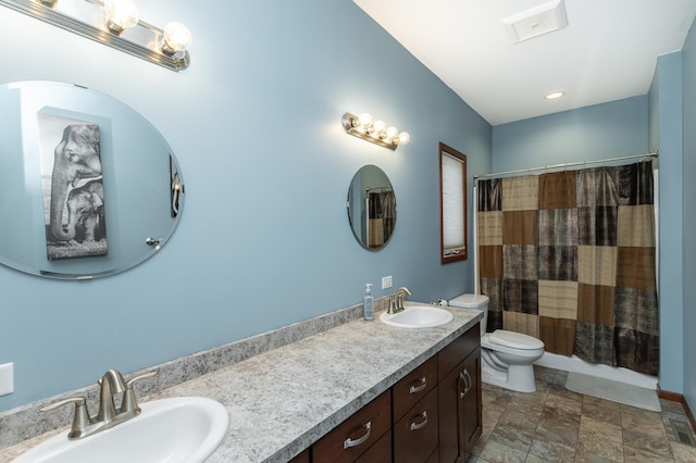 2155 Maple Leaf Ln NE, Owatonna, MN 55060 - bathroom featuring double vanity, a shower with curtain, and stone finish flooring