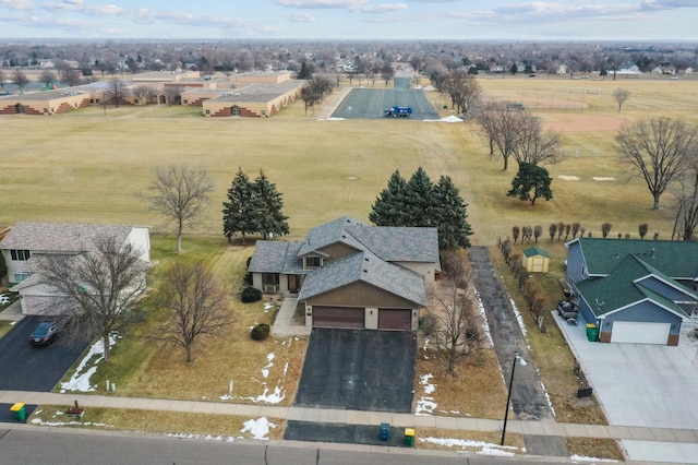 birds eye view of property with a rural view