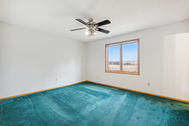 spare room with ceiling fan and carpet floors