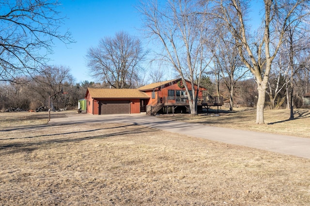 exterior space featuring a garage and a deck