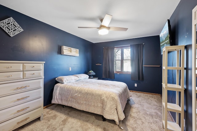 carpeted bedroom featuring ceiling fan and a wall mounted air conditioner