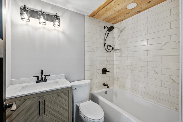 full bathroom featuring vanity, toilet, and tiled shower / bath