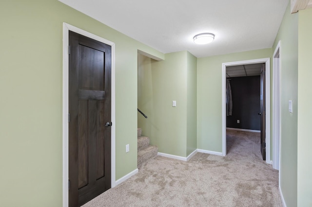 hallway with light carpet