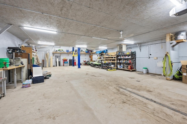 garage with ceiling fan and a garage door opener