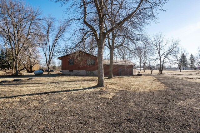 view of yard with a rural view