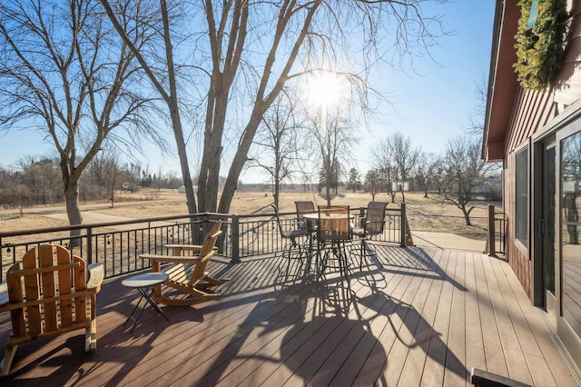 wooden terrace featuring a rural view