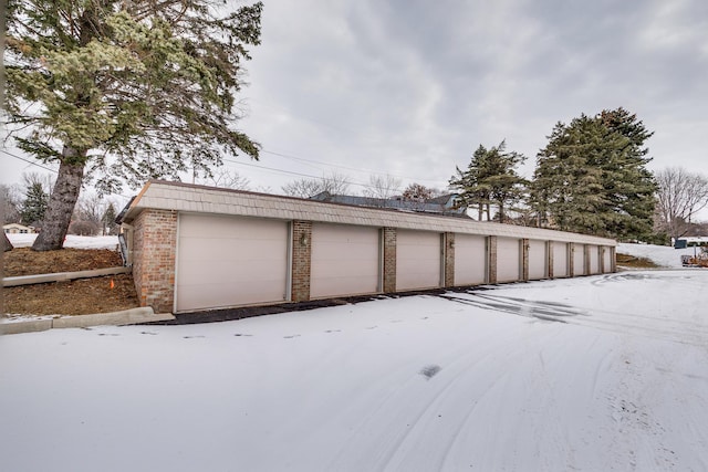 view of snow covered garage