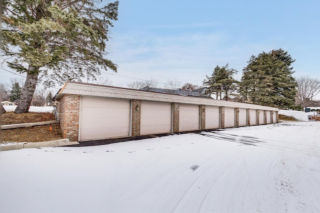 view of snow covered garage