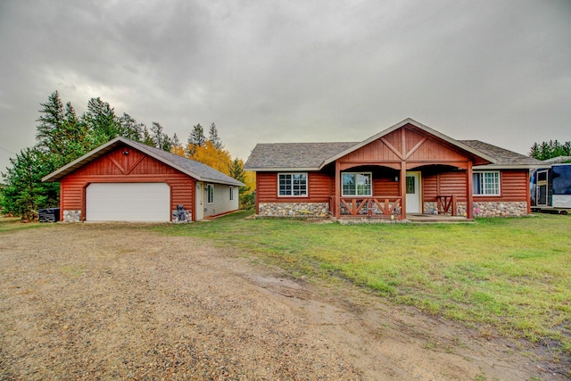 log-style house featuring covered porch, a garage, an outdoor structure, and a front lawn