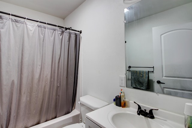 full bathroom with shower / tub combo with curtain, vanity, and toilet