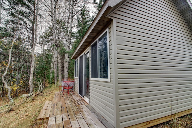 view of side of home featuring a wooden deck