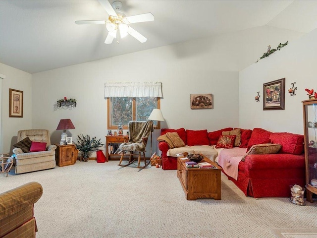 carpeted living room with ceiling fan and lofted ceiling