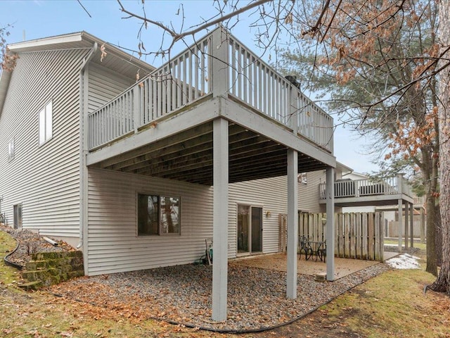 rear view of house with a wooden deck