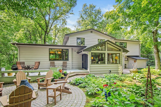 6678 Hemlock Ln N, Maple Grove, MN 55369 - back of property with a patio and an outdoor fire pit