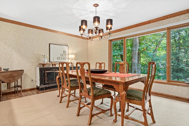 6678 Hemlock Ln N, Maple Grove, MN 55369 - dining area with healthy amount of natural light, a chandelier, wallpapered walls, baseboards, and ornamental molding