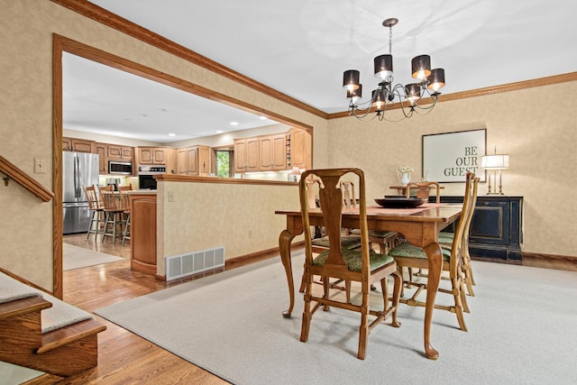 6678 Hemlock Ln N, Maple Grove, MN 55369 - dining area with a chandelier, light wood-style flooring, crown molding, baseboards, and recessed lighting