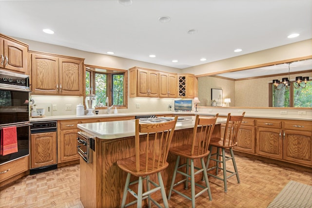 6678 Hemlock Ln N, Maple Grove, MN 55369 - kitchen featuring a kitchen bar, a center island, light countertops, a sink, and recessed lighting