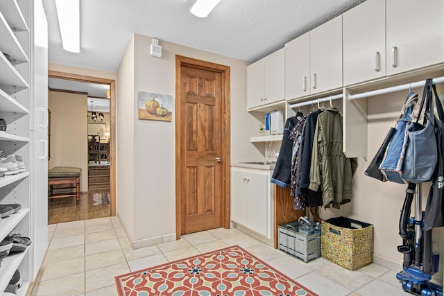 6678 Hemlock Ln N, Maple Grove, MN 55369 - spacious closet featuring light tile patterned floors