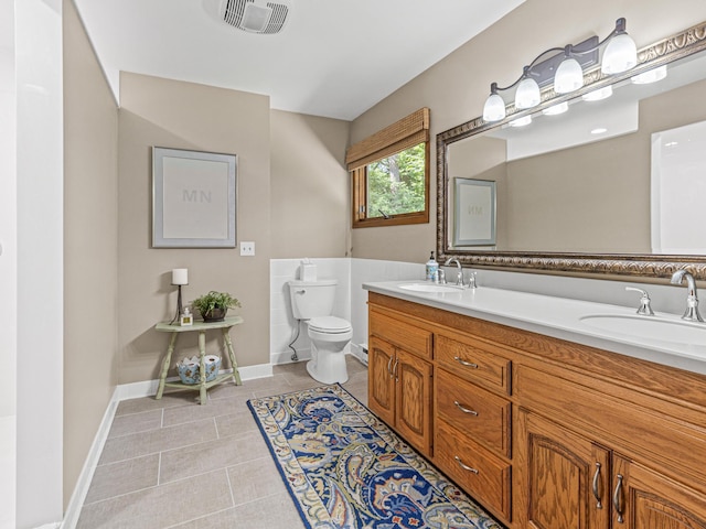 6678 Hemlock Ln N, Maple Grove, MN 55369 - full bathroom featuring toilet, tile patterned floors, double vanity, and baseboards