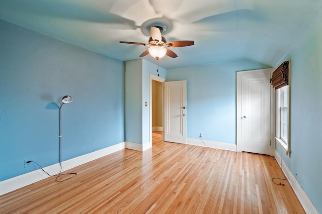 unfurnished bedroom with light wood-type flooring, ceiling fan, and lofted ceiling