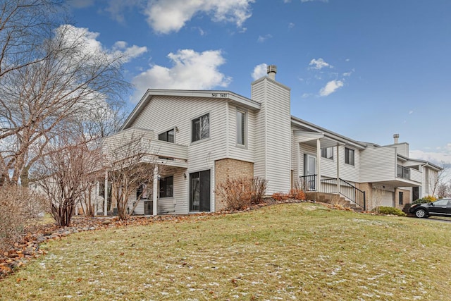 view of home's exterior featuring a yard and a garage