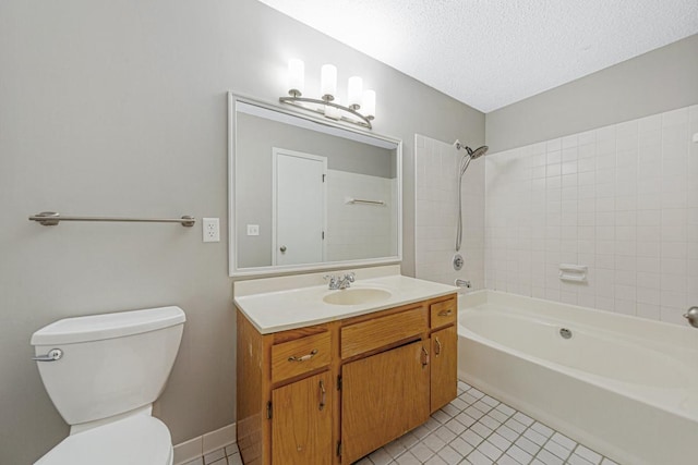 full bathroom with vanity, tile patterned flooring, tiled shower / bath combo, toilet, and a textured ceiling