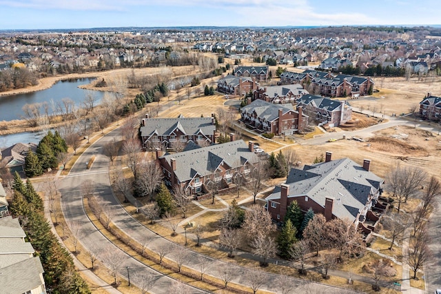 bird's eye view featuring a residential view and a water view