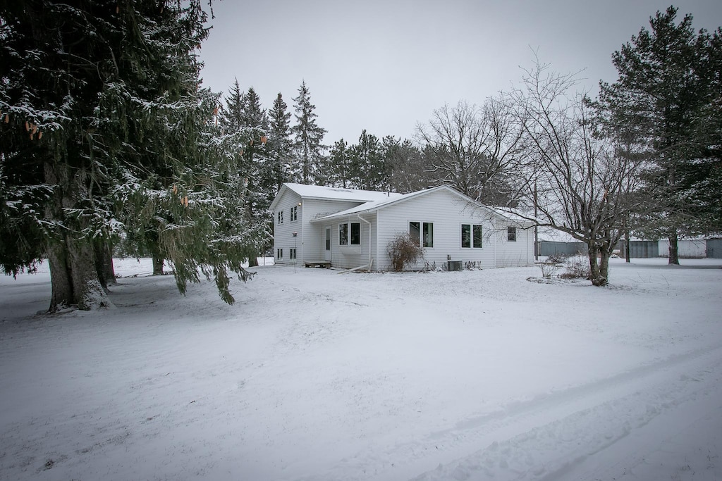 view of snow covered property