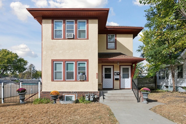 3532 Longfellow Ave, Minneapolis, MN 55407 - view of front of home featuring stucco siding, fence, and cooling unit