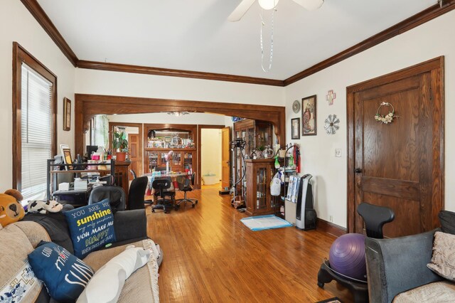 3532 Longfellow Ave, Minneapolis, MN 55407 - living room with crown molding, wood finished floors, a ceiling fan, and baseboards
