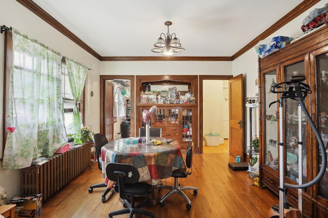 3532 Longfellow Ave, Minneapolis, MN 55407 - dining area with radiator heating unit, light wood-style flooring, a chandelier, and ornamental molding