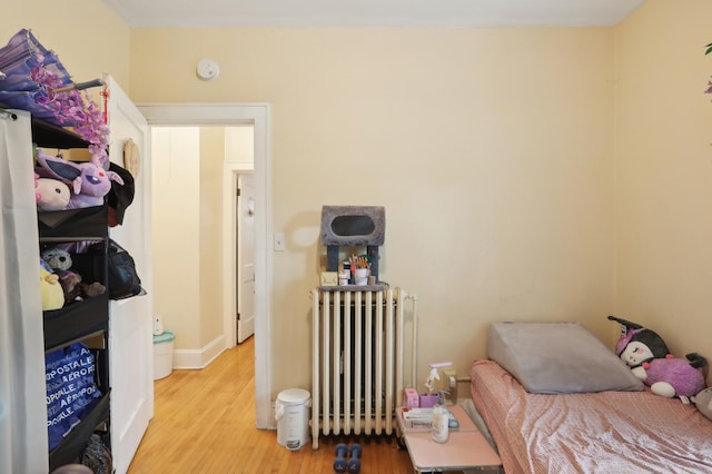 3532 Longfellow Ave, Minneapolis, MN 55407 - bedroom featuring radiator and wood finished floors