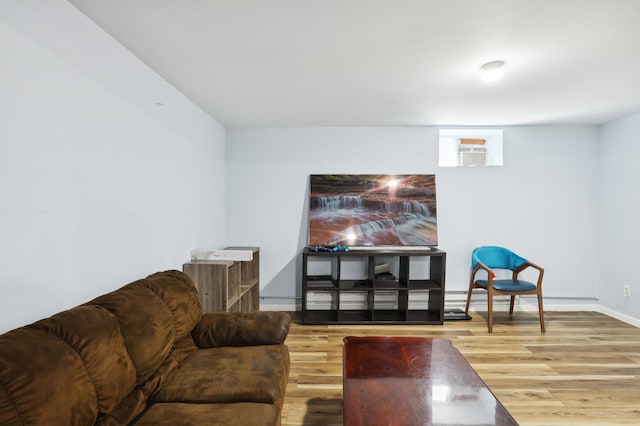 3532 Longfellow Ave, Minneapolis, MN 55407 - living area featuring wood finished floors, baseboards, and a baseboard radiator