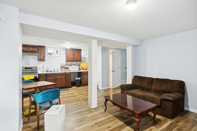 3532 Longfellow Ave, Minneapolis, MN 55407 - living room with light wood-style flooring and baseboards